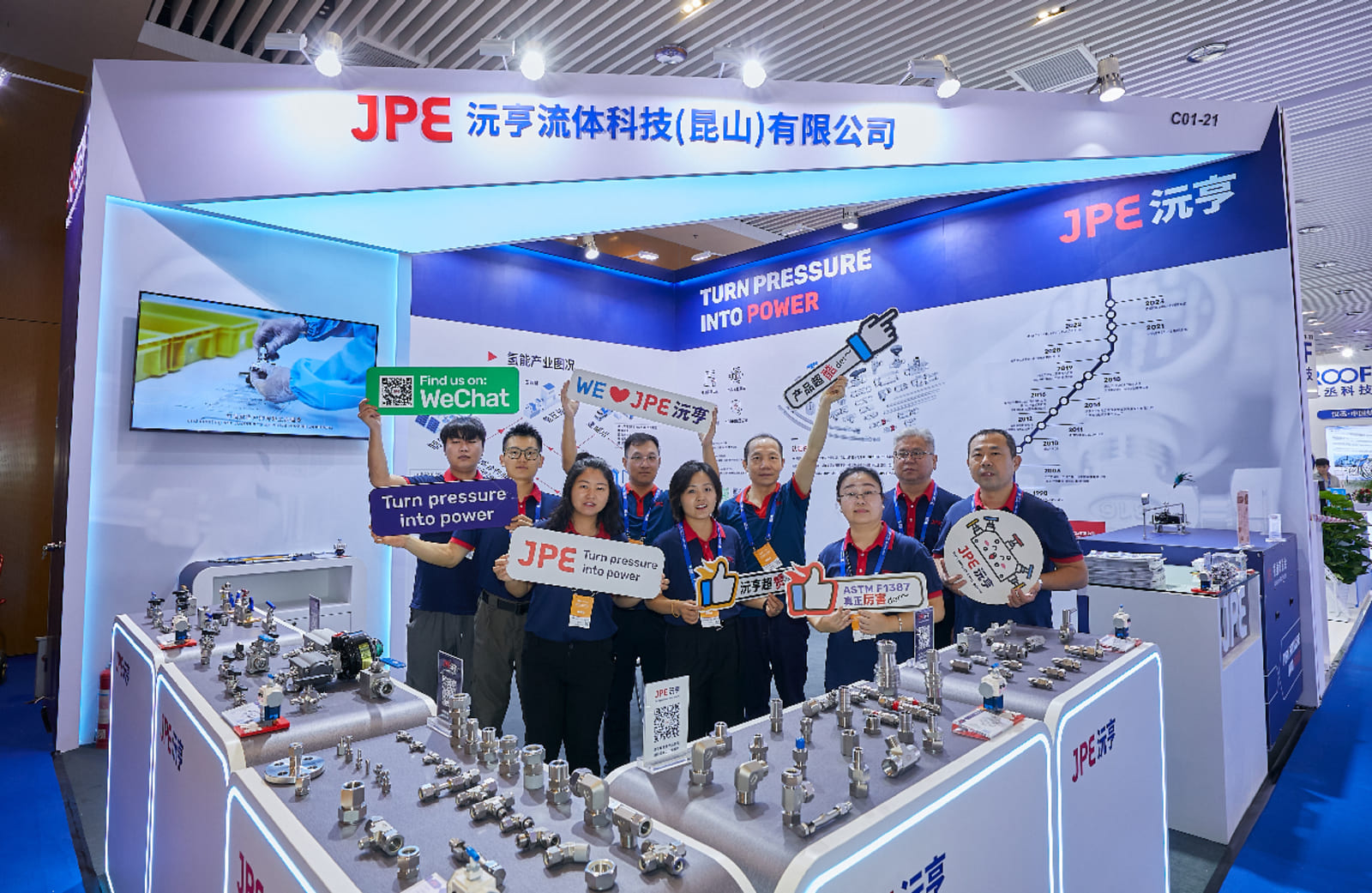 JPE team group photo at CHFE 2024 Foshan booth featuring high-safety fluid fittings and valves for hydrogen systems